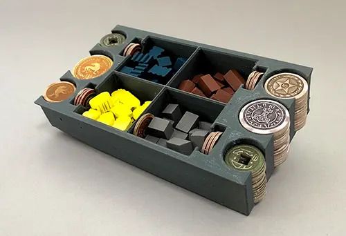 A game board with different tokens and coins
Description automatically generated