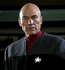 A person in a black uniform
Description automatically generated